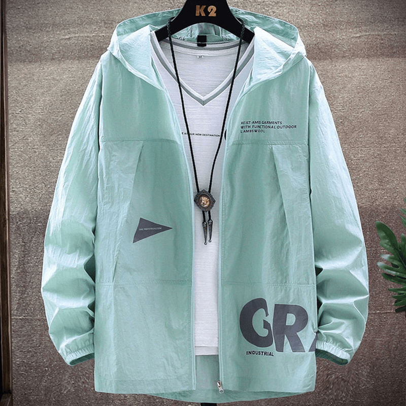 Mint green slim-fit windbreaker jacket with hood and zipper, perfect for sports and outdoor activities, hanging on a black hanger.