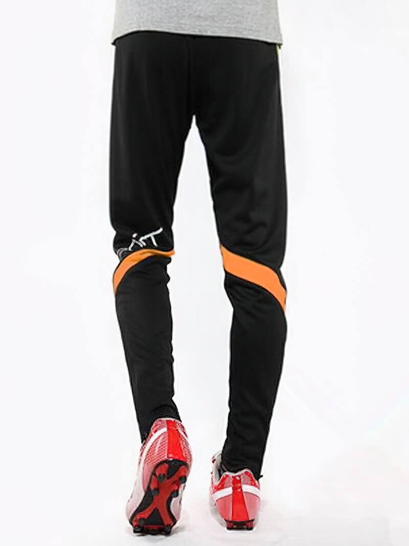 Male sports elastic waist trousers for workouts, black with orange accents, designed for comfort and performance. Model SF0446.