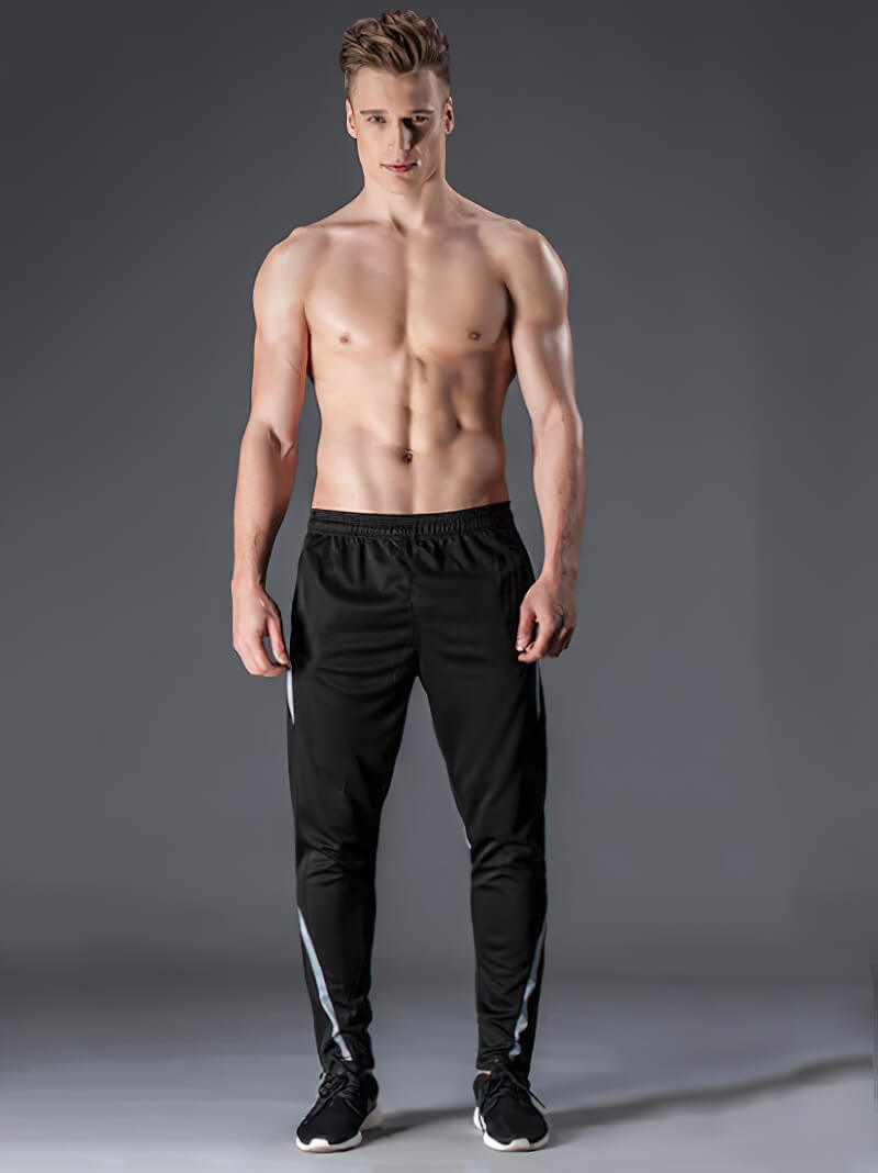 Male model wearing black elastic waist sports trousers, ideal for workout and running, made of breathable polyester - SF0446