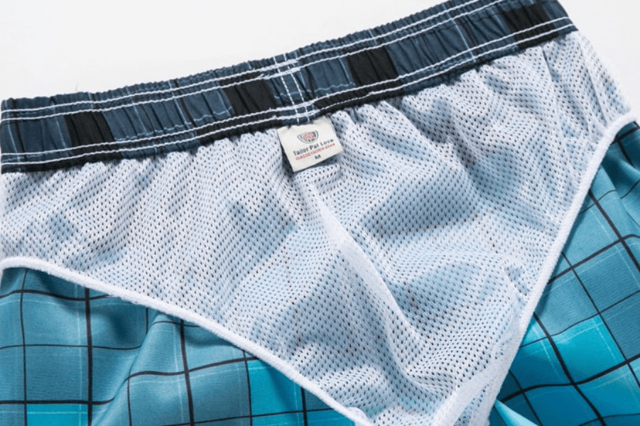 Men's quick dry beach shorts with mesh lining in blue plaid, featuring a comfy waistband and secure side pocket, model SF0860.