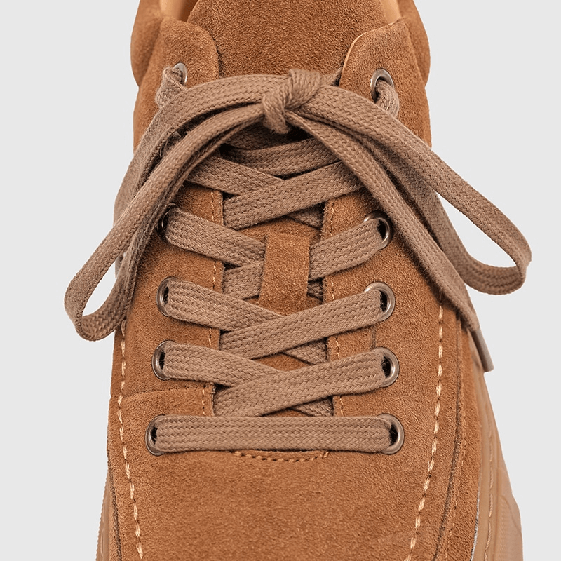 Close-up of stylish brown leather sneaker with laces, part of the Men's Breathable Casual Shoes collection, model SF0973.
