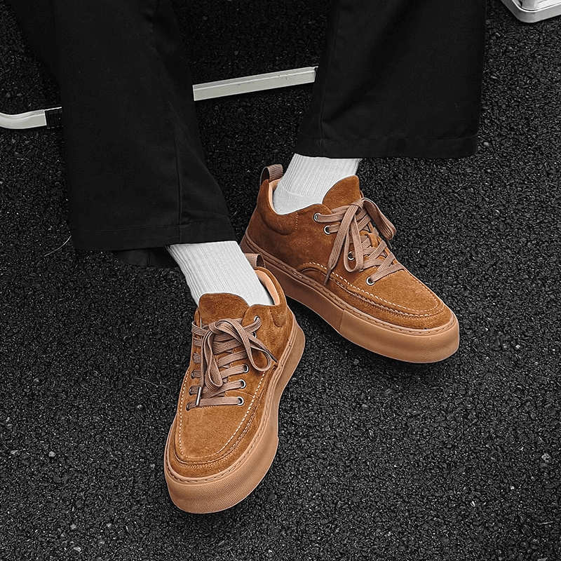 Stylish leather sneakers in brown with breathable design and flexible rubber outsole for men. Perfect mix of comfort and fashion in casual wear.