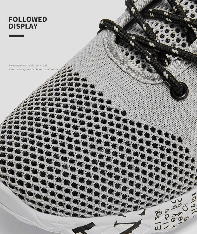 Close-up of Men's Casual Lace-up Mesh Sneakers with breathable mesh upper in gray, showcasing texture and black laces.