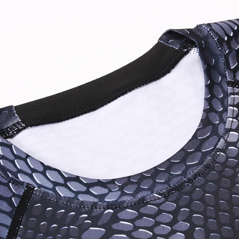 Close-up of men's compression top with O-neck and snake skin 3D print for running.