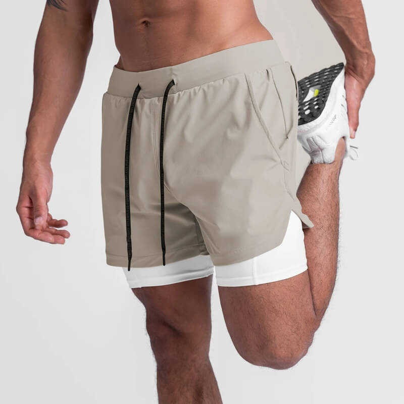 Man stretching in men's double-layer sports running shorts with pockets, showcasing athletic style and comfort.