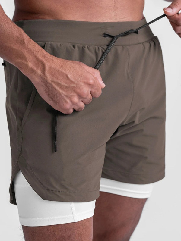Men's double-layer sports running shorts with pockets, featuring a drawstring closure, perfect for active training.