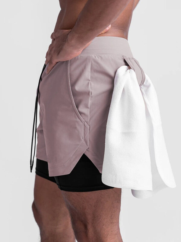 Side view of men's double-layer sports running shorts with pockets and towel, highlighting comfort and style for active lifestyles.