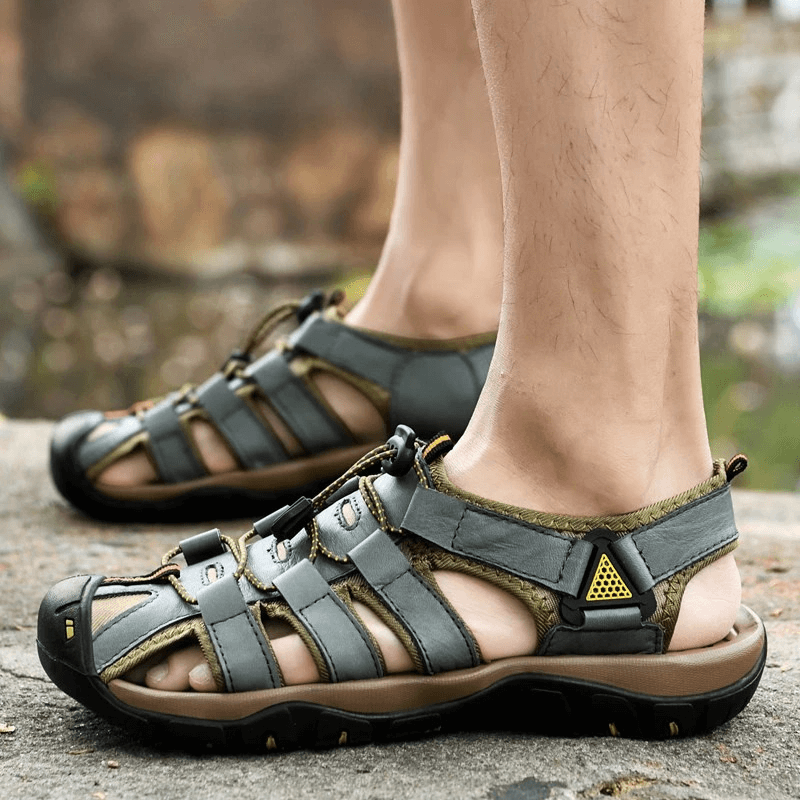 Men's genuine leather lightweight sandals for outdoor beach activities, featuring elastic straps, mesh lining, and rubber outsole.