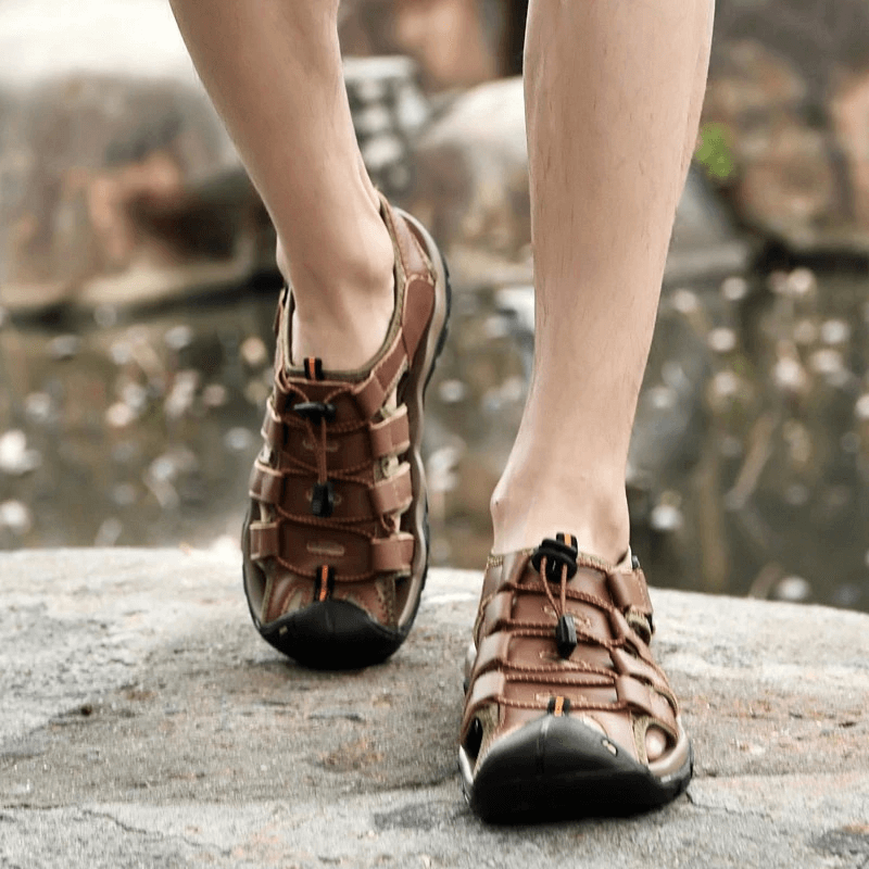 Man wearing men's genuine leather lightweight sandals walking outdoors