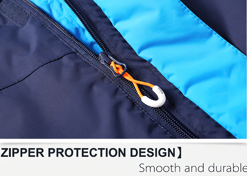 Close-up of zipper protection design on men's ski jacket, showcasing smooth and durable features with blue and black material.