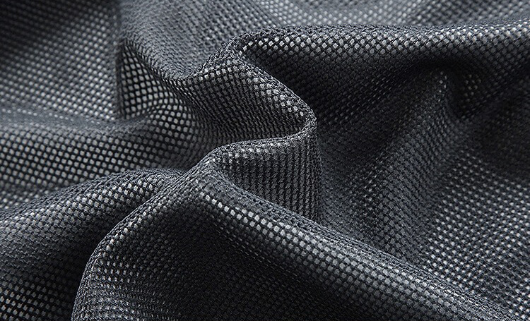 Close-up of black quick-drying polyester fabric used in men's mountaineering jacket, showcasing texture and windproof capability.