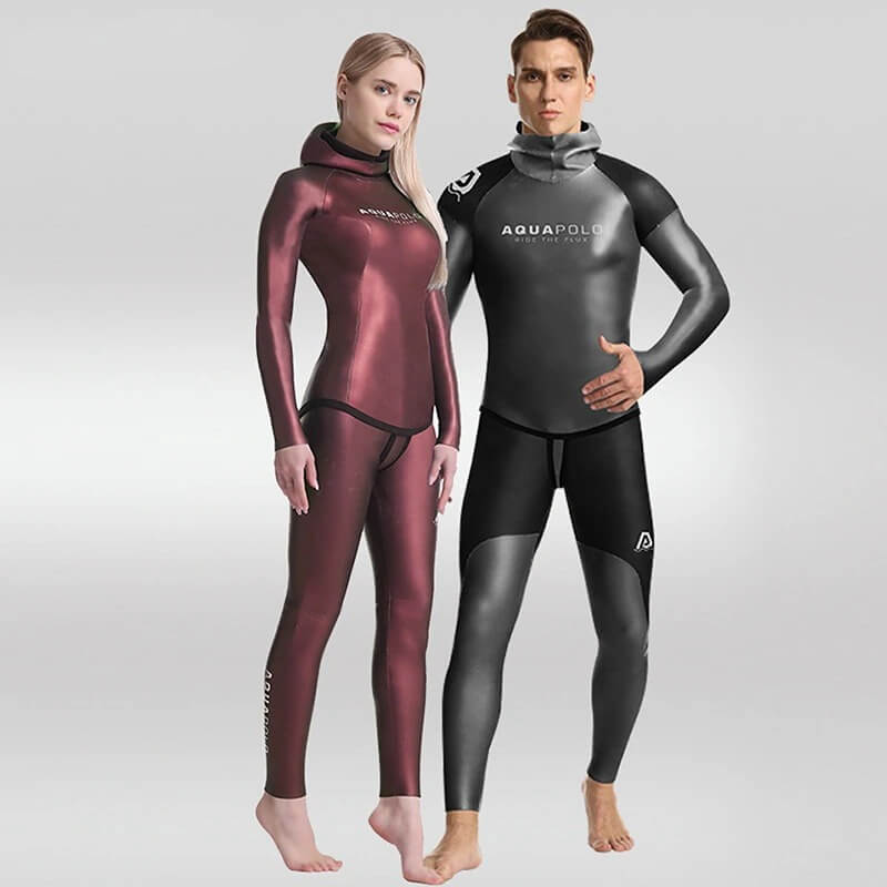 Two models wearing men's and women's neoprene wetsuits, showcasing flexible and durable aquatic sportswear for activities like spearfishing.