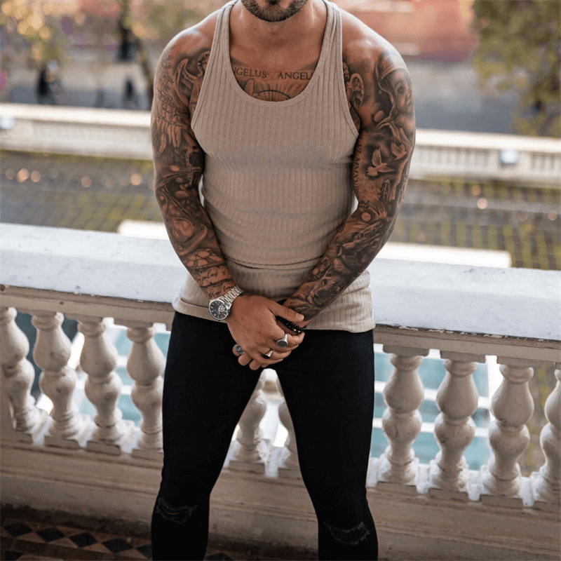 Model wearing Men's Pure Color Sports Tank Top, sleeveless and stylish, perfect for fitness and athletic activities.