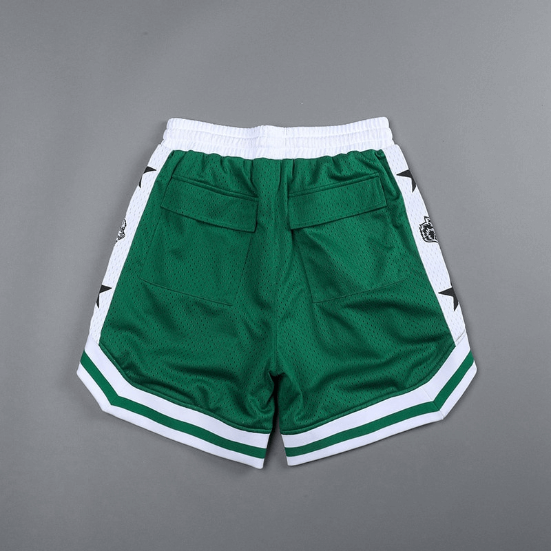 Men's green basketball shorts with pockets, white trim, and quick-drying fabric for running and sports activities.