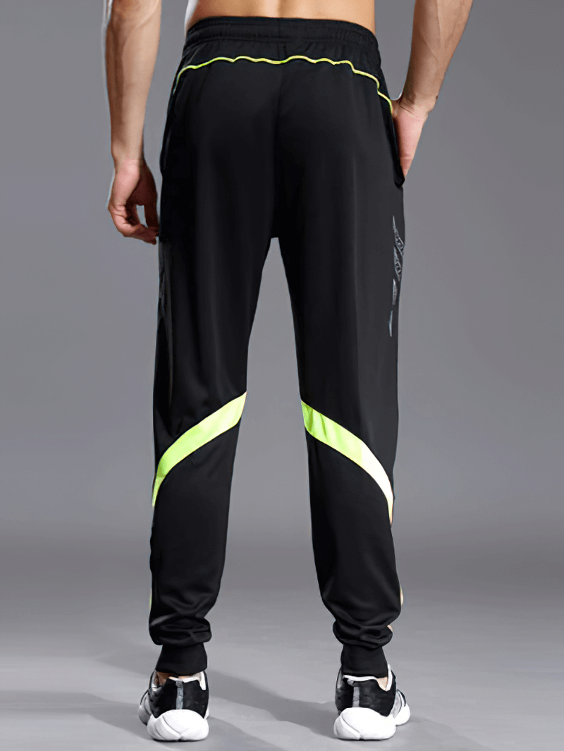 Back view of men's running sports pants with zipper pockets, featuring a full-length design and neon accents, perfect for running. SF0442