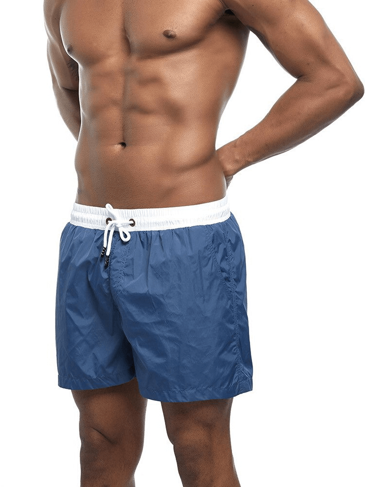 Men's quick dry swimming shorts in solid blue color, perfect for beach activities, lightweight polyester with white drawstring - SF0863