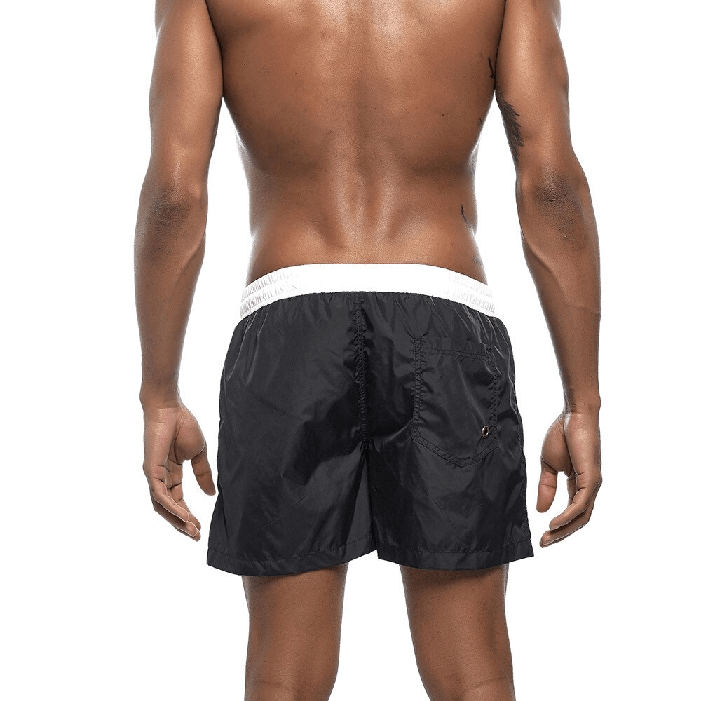 Men's quick dry swimming shorts in black, shown from the back. Ideal for beach activities, featuring lightweight, durable polyester.