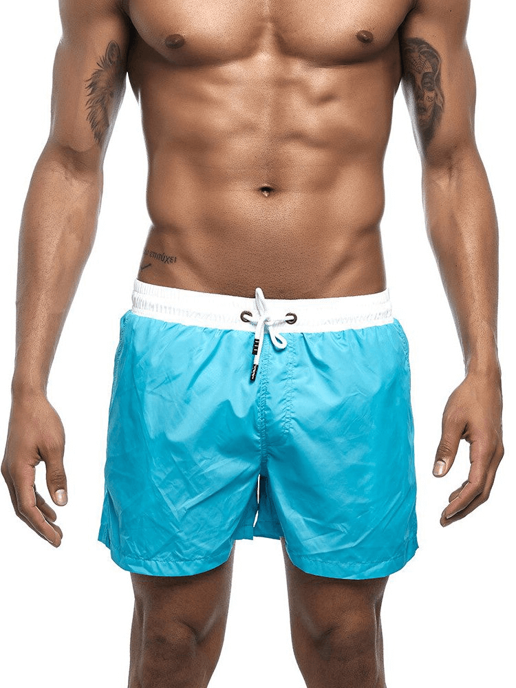 Men's quick dry swimming shorts, solid pattern, blue, beachwear, lightweight polyester, comfortable fit, perfect for summer activities.