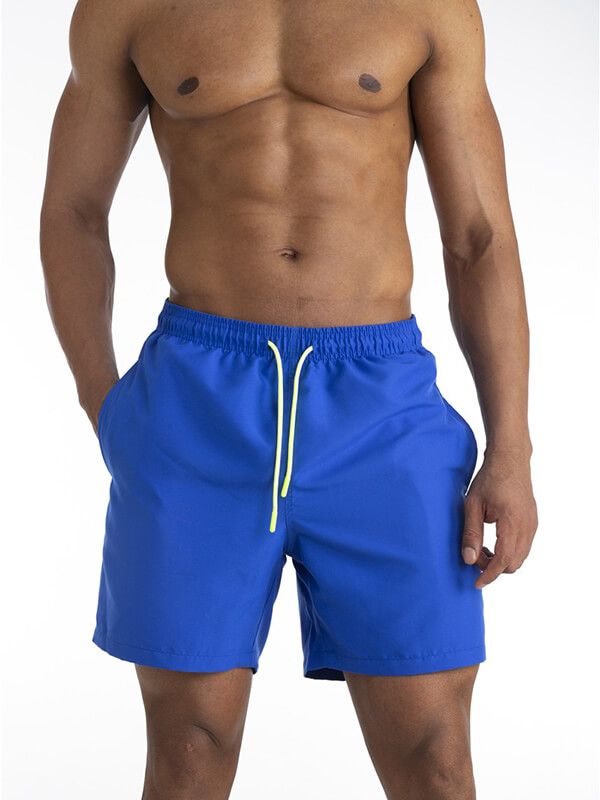 Men's blue solid color boardshorts with drawstring, quick-drying polyester, pockets included. Ideal male swimwear SF0831.
