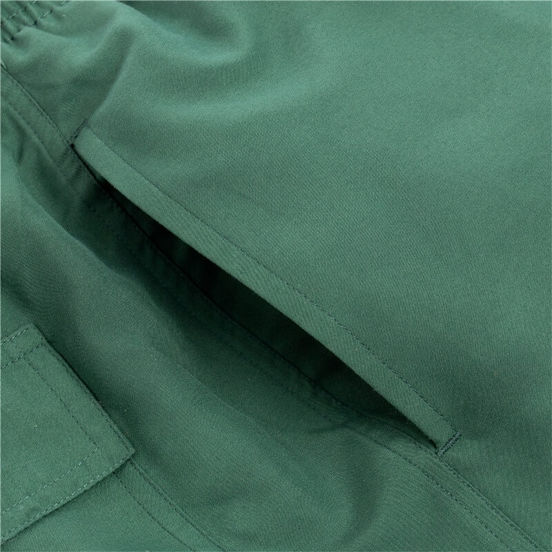 Close-up of men's solid color boardshorts pocket, quick-drying polyester swimwear
