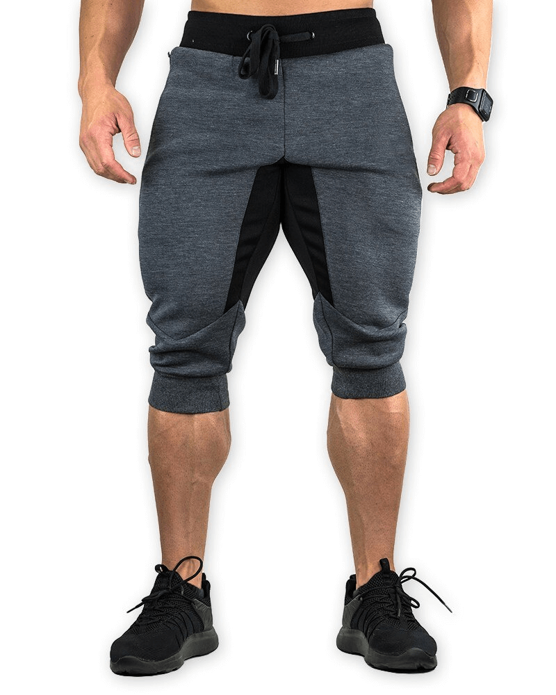 Men's sports shorts with zippered pockets for running, featuring a breathable cotton-polyester blend for training.