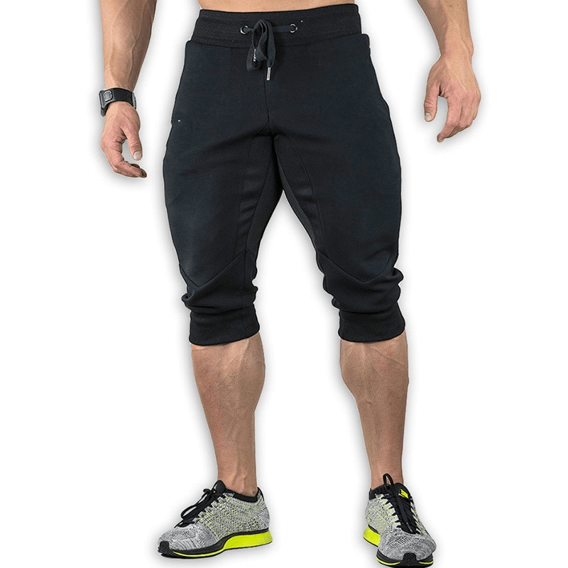 Men's sports shorts with zippered pockets in black, perfect for training. Breathable, durable cotton and polyester blend. SF1134.
