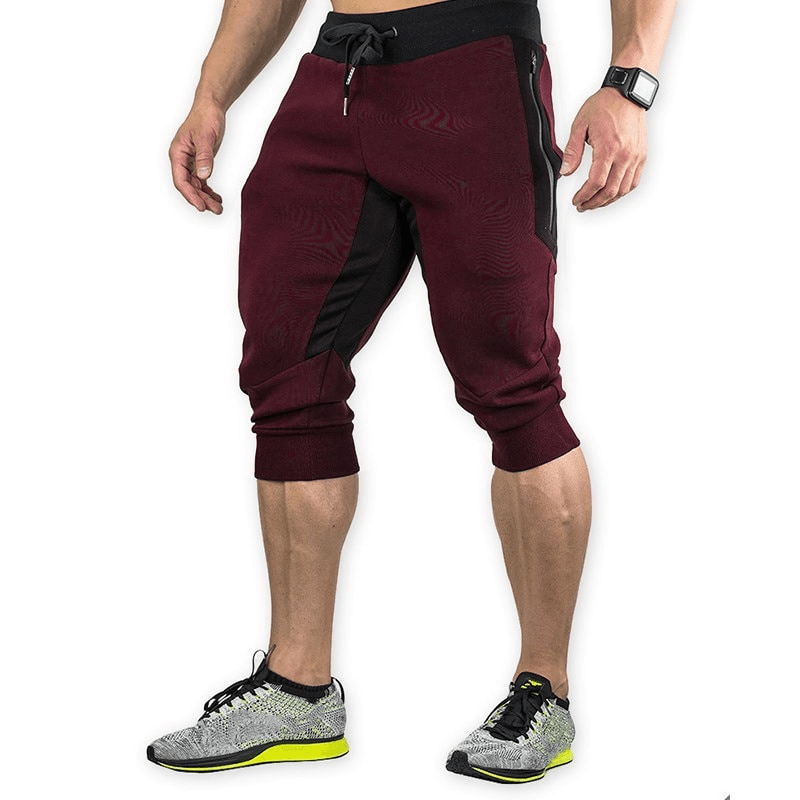 Men's sports shorts with zippered pockets SF1134, perfect for running. Made from durable cotton and polyester in solid maroon color.