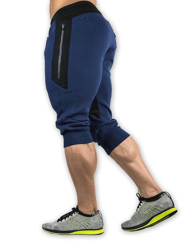 Men's sports shorts with zippered pockets for training; navy blue with black accents; cotton-polyester blend for running.