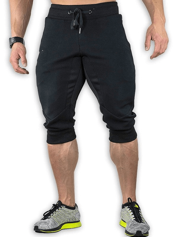 Men's sports shorts with zippered pockets for training, breathable running shorts in cotton polyester blend, perfect for workouts.