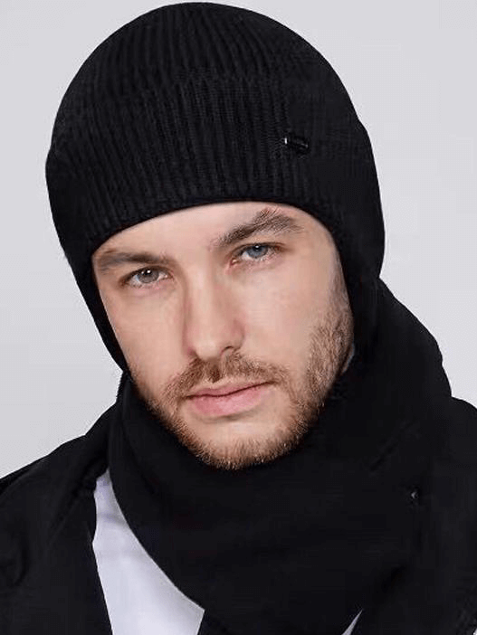 Man wearing a men's sports warm running knitted earflaps bonnet hat in black with scarf, perfect for chilly outdoor activities.