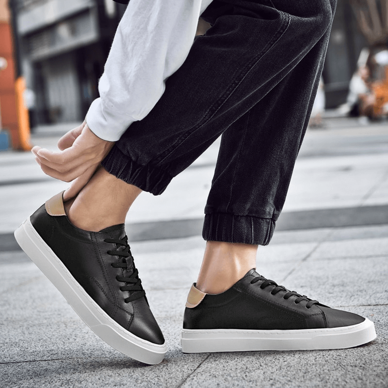 Men's sporty flexible flat sole sneakers SF1172, genuine leather, casual shoes in action on city street.