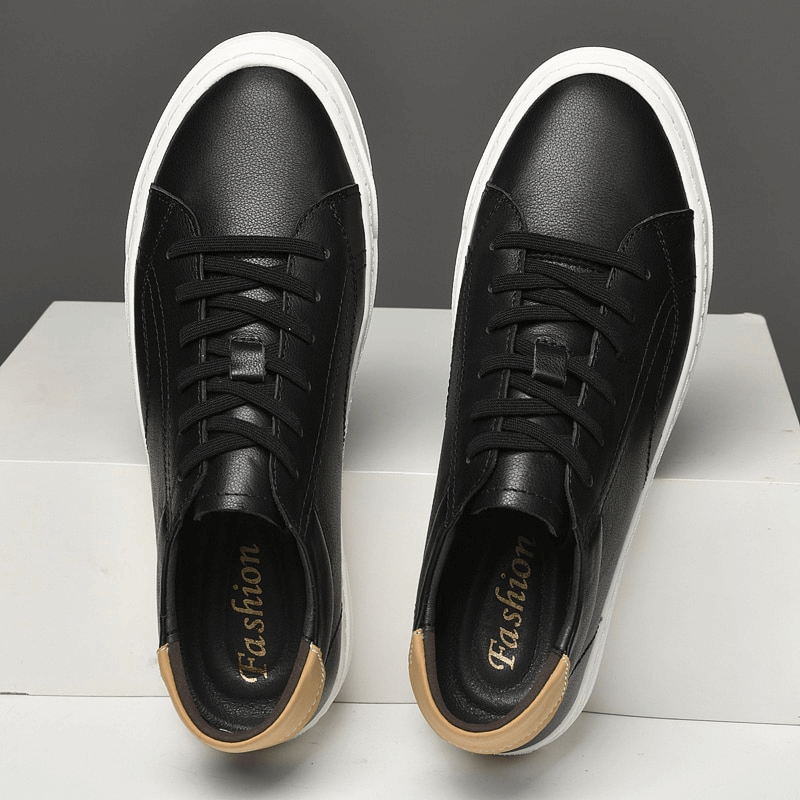 Men's sporty black sneakers with flexible flat sole and genuine leather uppers, featuring lace-up closure for casual comfort.