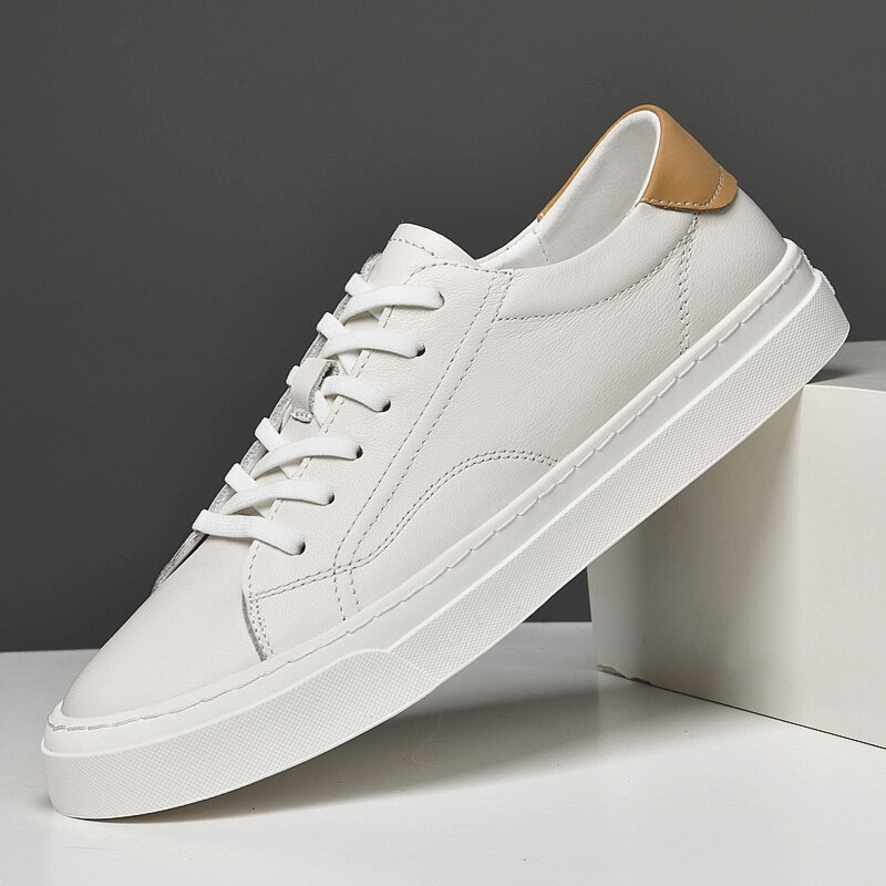 Men's sporty flexible flat sole sneaker in white with leather upper and synthetic outsole, perfect for casual wear. Model SF1172.