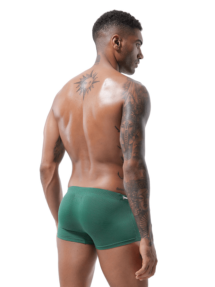 Back view of man wearing green men's swimming drawstring boxers, showing tattoo and fit design, perfect for beachwear. SF0810