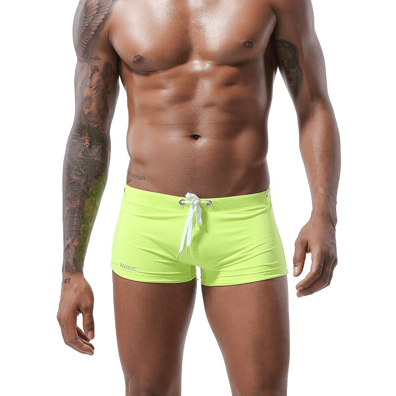Bright green men's swimming drawstring boxers with low waist, perfect for beach and pool activities.