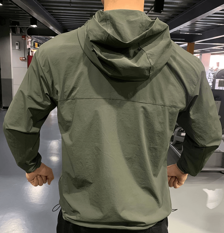 Man wearing green windproof waterproof sports sweatshirt with hood, designed for outdoor training in any weather, SF0891 model.