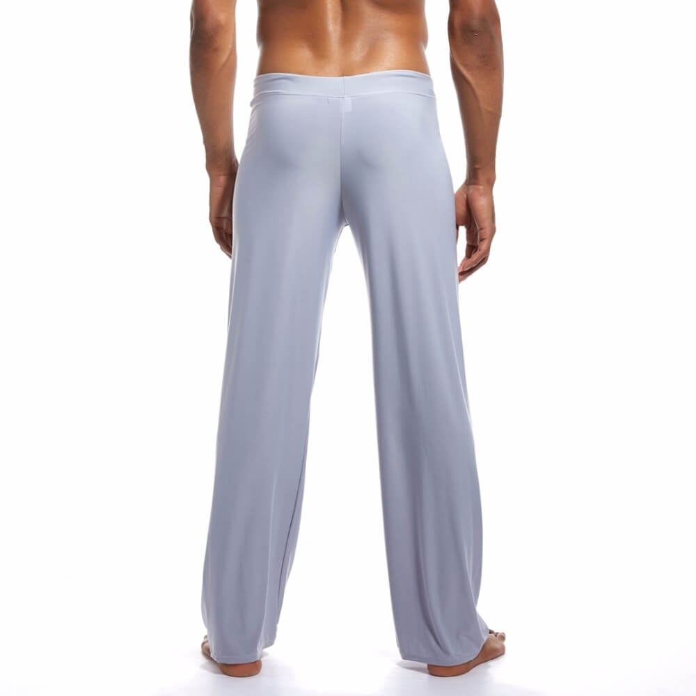 Back view of men's yoga loose full-length pants, light gray, designed for flexibility and comfort with a secure drawstring fit.