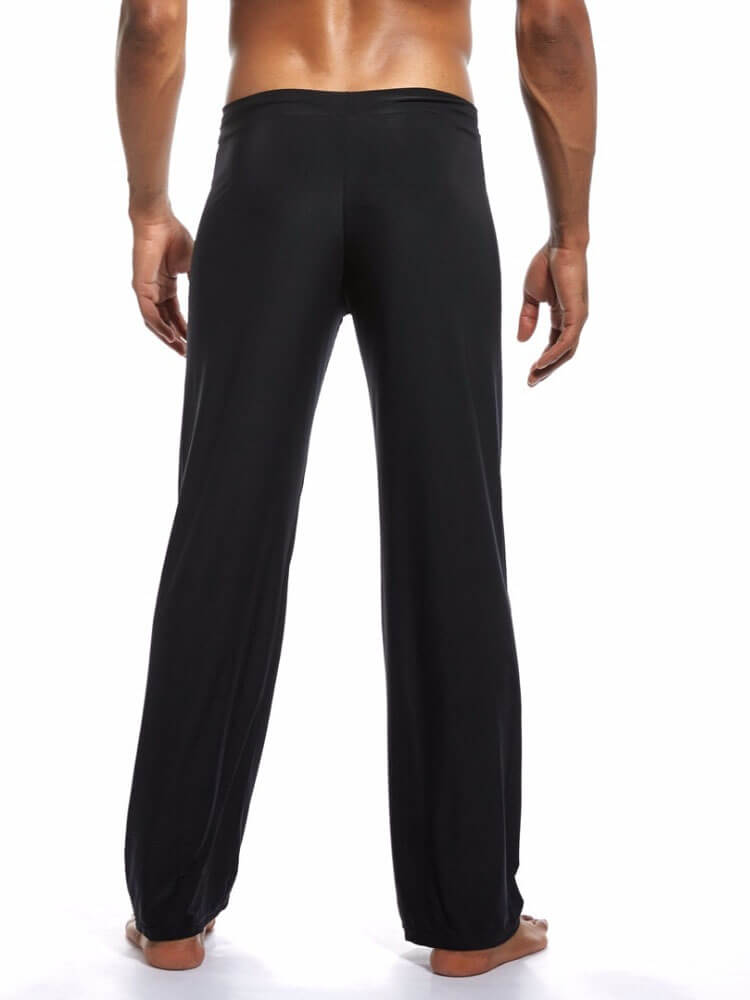 Men's black yoga pants full-length loose fit back view for optimal comfort and motion.