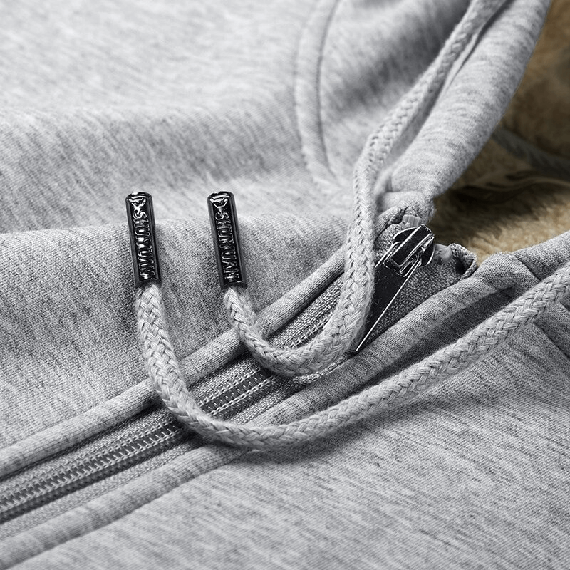 Close-up of gray men's zip-up hoodie with drawstring, showcasing thick warm fabric ideal for winter wear.