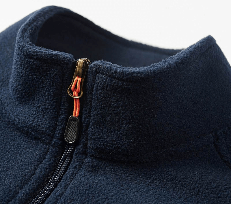 Close-up of men's navy zipper stand collar fleece hiking jacket, showcasing durable hardware and cozy material for outdoor adventures.