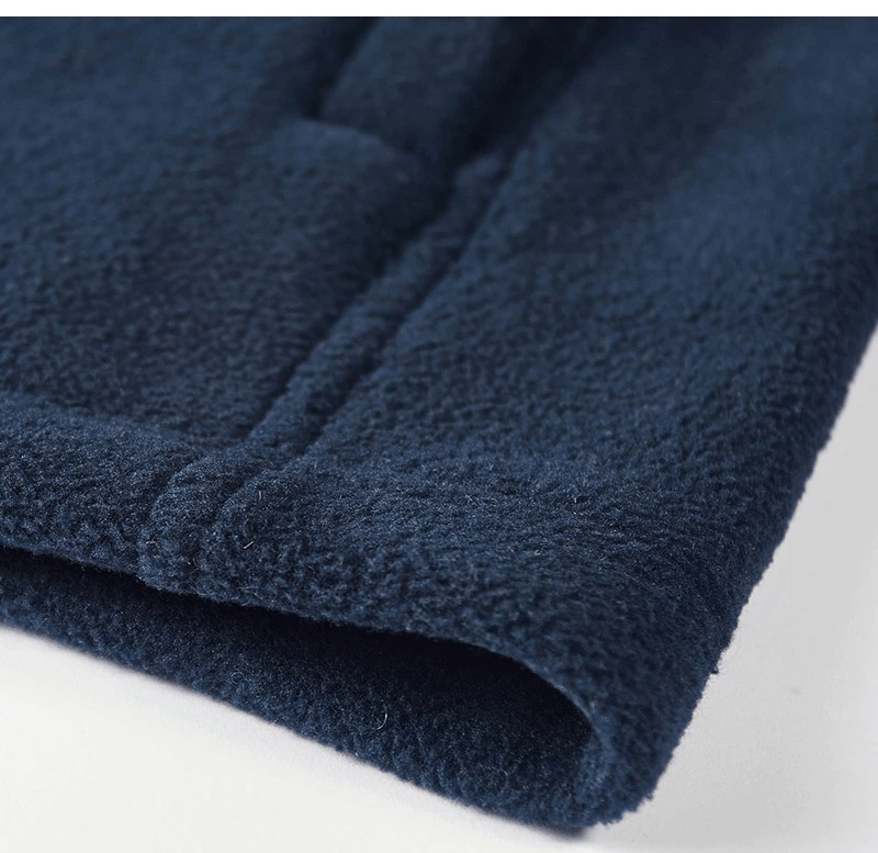 Close-up of men's fleece hiking jacket in navy, showcasing soft texture and durable stitching for warmth and adventure.
