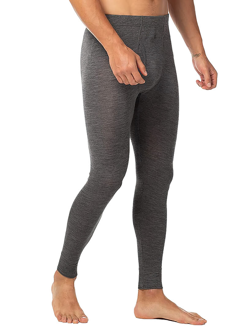 Man wearing grey Merino wool thermal base layer leggings for warmth and insulation.