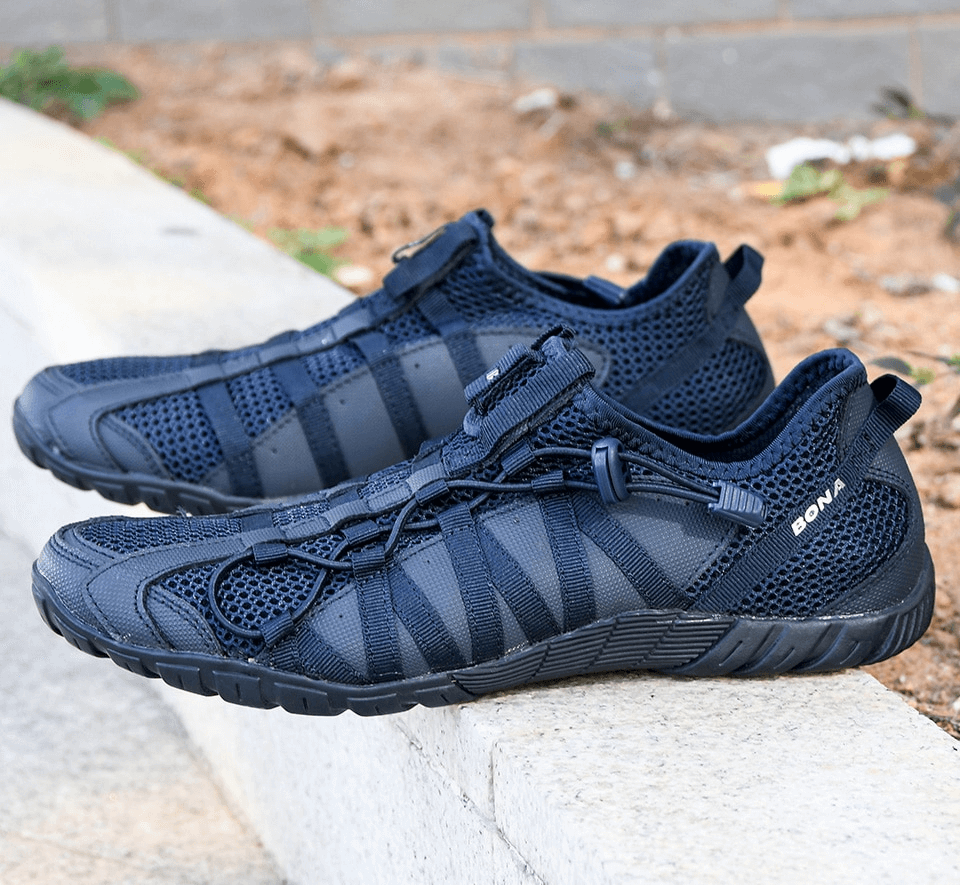 Mesh breathable men's sneakers with flexible rubber soles for lightweight comfort and support, shown in stylish solid design. Model SF0751.