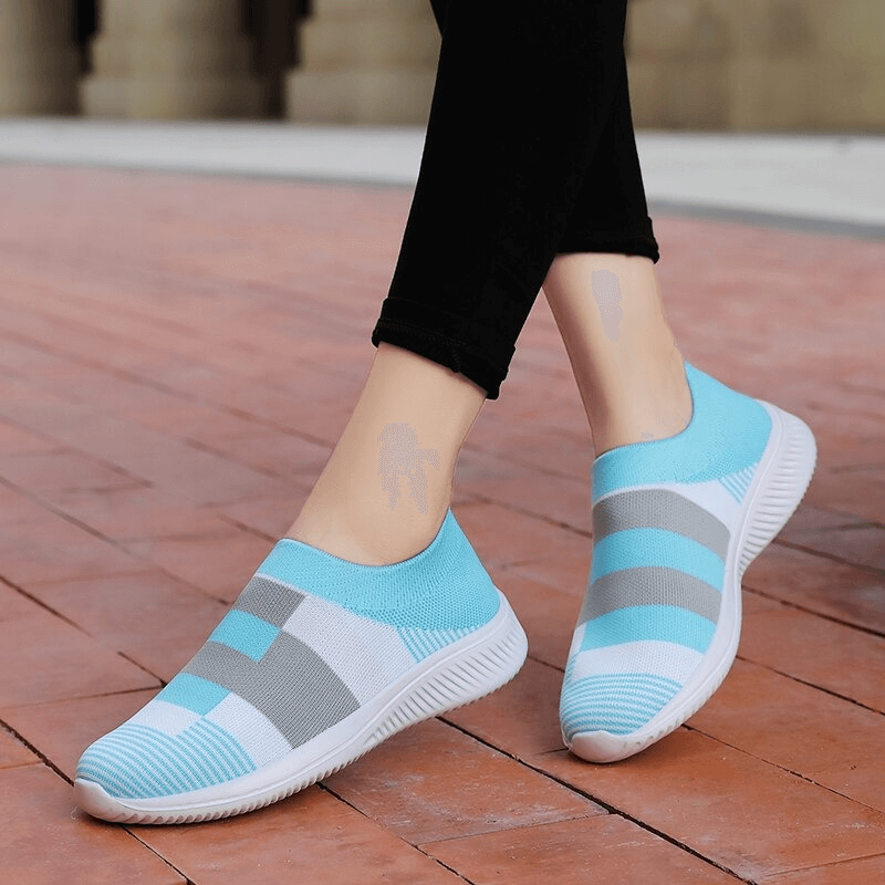 Light blue and gray mesh breathable women's shoes, stylish sports sneakers SF0267 on brick walkway, showcasing modern design.