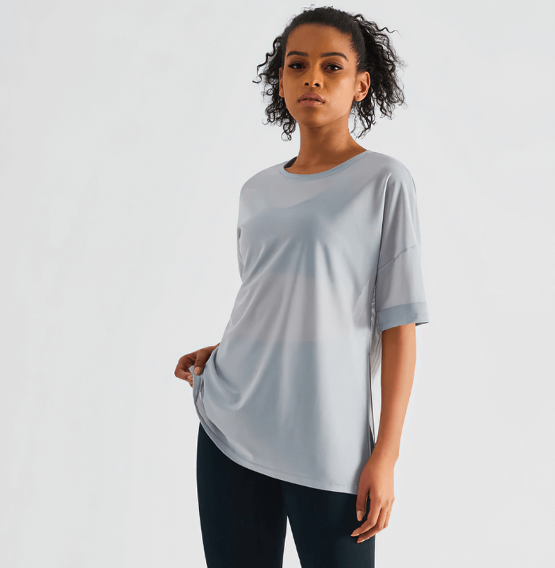 Woman wearing mesh casual sports T-shirt, short sleeves, quick-drying, fitness wear for women, style SF0052, yoga-ready outfit