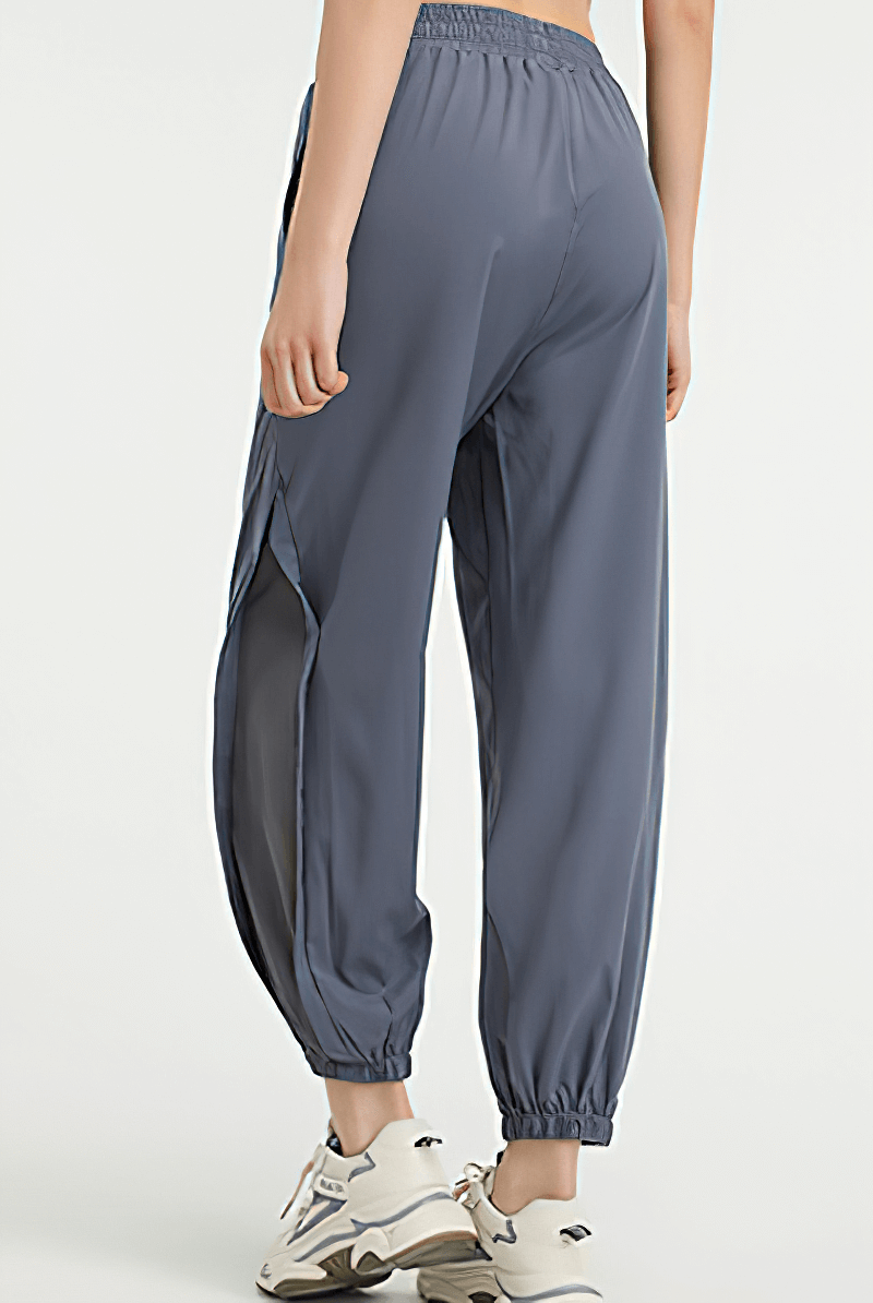 Back view of women's mesh drawstring running trousers in blue, ideal for yoga, pilates, and workouts.