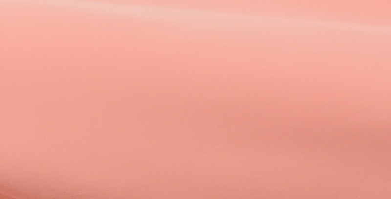 Close-up of light coral-colored mesh fabric texture for sportswear.