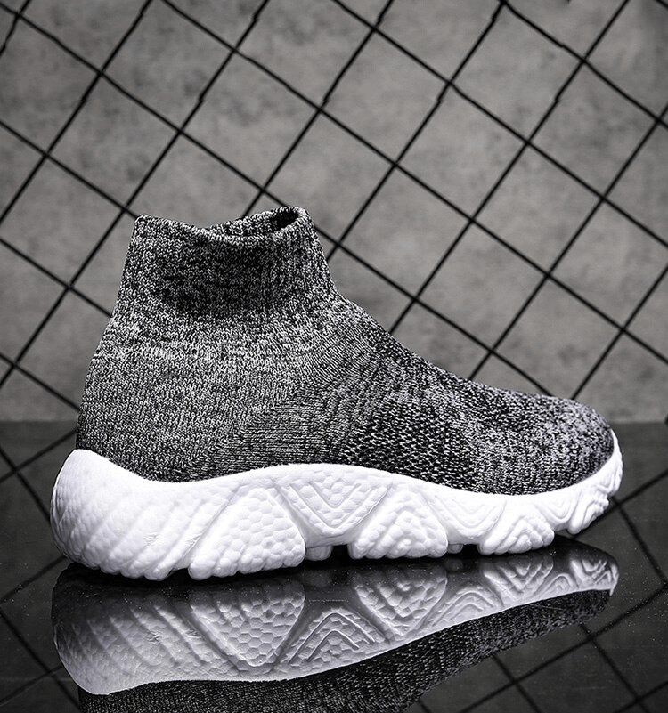 Mesh elastic breathable unisex sneaker SF1215 with air mesh and EVA cushioning in gray, displayed on reflective surface.