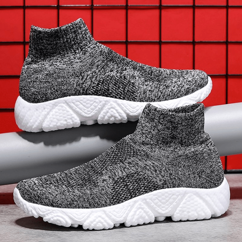 Mesh Elastic Breathable Unisex Sneakers SF1215, knitted design, white sole, sport shoes, slip-on, air mesh, red background.