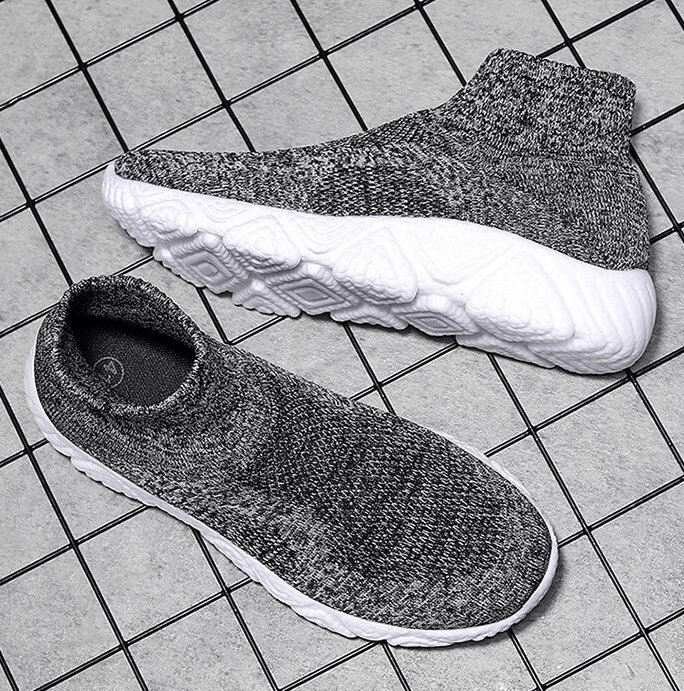 Mesh elastic breathable unisex sneakers with slip-on design and EVA cushioning, showcasing top and side views on tiled floor.